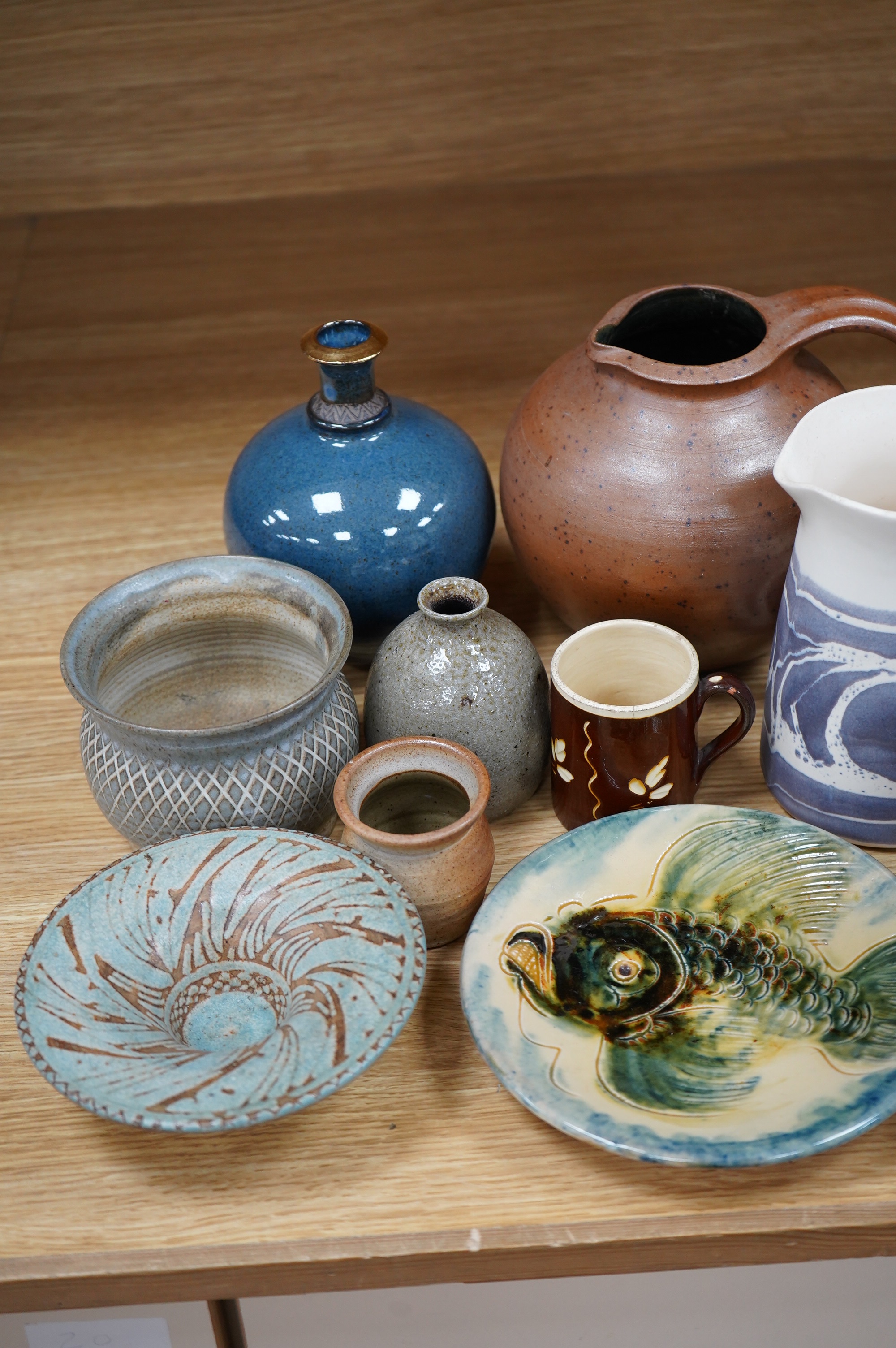 A collection of fourteen mixed studio pottery vases, bowls and jugs etc. Condition - good